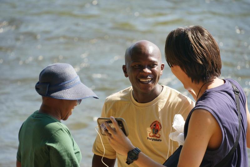 Three students laughing