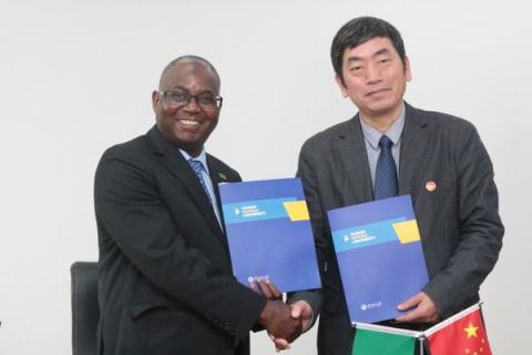UNZA Vice-Chancellor, Prof. Luke Mumba and HUNNU Vice-President Prof. Li Dazhi exchange MoU documents
