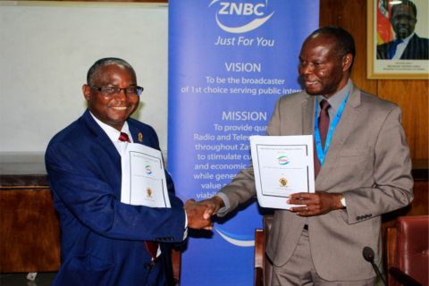 UNZA Vice-Chancellor, Prof. Luke Mumba (left), shakes hands with ZNBC Director General, Mr. Richard Mwanza (right), after  signing the Memorandum of Understanding in the Senate Chamber. 
