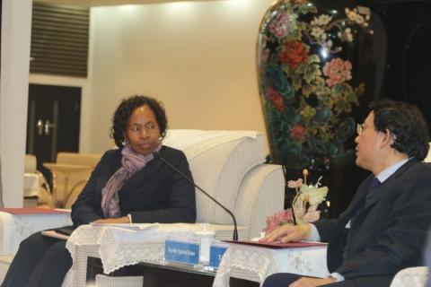 Permanent Secretary Ministry of Higher Education, Ms Kayula Siame receiving a brief from the XJTU Vice President Professor Xi Guang